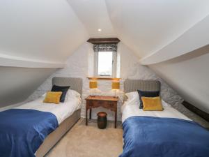 Llit o llits en una habitació de The Old Swill House