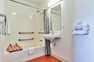 a bathroom with a sink and a shower at Motel 6-Irving, TX - Dallas in Irving