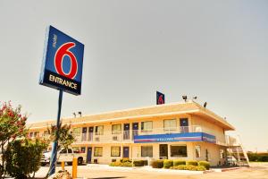a building with a sign in front of it at Motel 6-Irving, TX - Dallas in Irving
