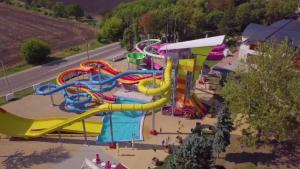 an aerial view of a water park with a water slide at Írisz Apartman in Mezőkövesd