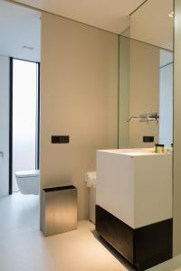 a bathroom with a sink and a mirror at Hotel Privo in Târgu-Mureş