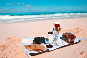 a tray with a breakfast on the beach at Retal View North Coast Aqua Park in El Alamein