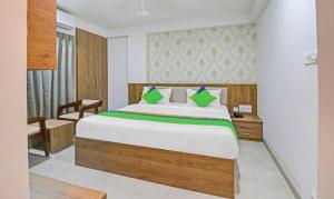 Uma cama ou camas num quarto em Treebo Chandraprasth Residency