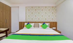 Uma cama ou camas num quarto em Treebo Chandraprasth Residency