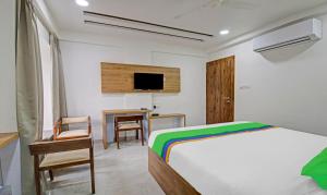 Uma cama ou camas num quarto em Treebo Chandraprasth Residency
