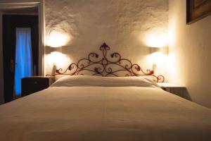 Postel nebo postele na pokoji v ubytování Cascina Des Religieuses
