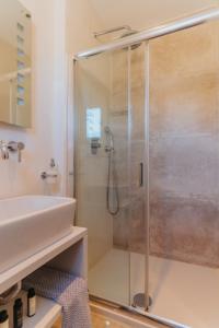 a bathroom with a shower and a sink at Mouras studios in Livadi Astypalaias +98 photos