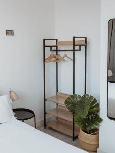 A bed or beds in a room at Apartamentos Espai Progres by Be Barcelona