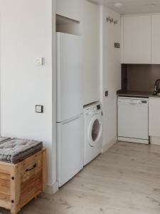 A kitchen or kitchenette at Apartamentos Espai Progres by Be Barcelona