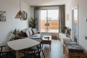 A seating area at Apartamentos Espai Progres by Be Barcelona