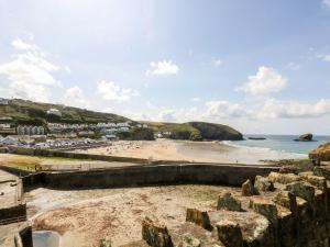 a view of a beach with people on it at Mews House in Camborne