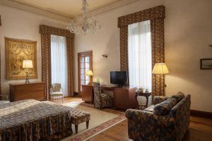 TV a/nebo společenská místnost v ubytování Hotel Villa Giona