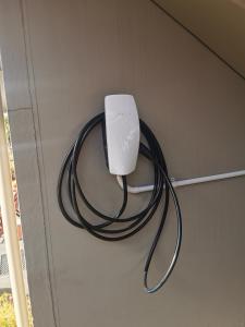 a computer mouse is hooked up to a wall at 555 Motel Dunedin in Dunedin