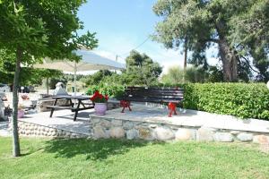 a park with a bench and a picnic table at Panorama Siviris in Siviri