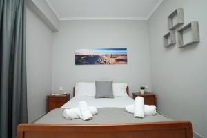 a bedroom with a large bed with white pillows at Panorama Siviris in Siviri