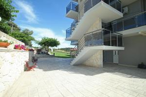 a building with a staircase on the side of it at Panorama Siviris in Siviri