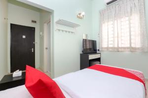 Krevet ili kreveti u jedinici u objektu OYO 90132 Come Inn Premium