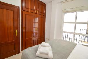 Posteľ alebo postele v izbe v ubytovaní Letmalaga Economy San Telmo