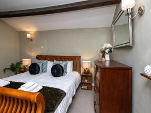 Ένα ή περισσότερα κρεβάτια σε δωμάτιο στο Pemba Cottage
