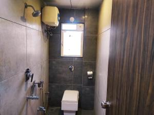 Koupelna v ubytování Hotel Manasi INN