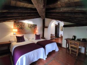 Llit o llits en una habitació de Hotel Rural La Cerámica