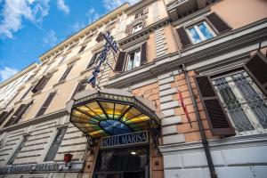 a building with a stained glass sign on it at Hotel Marisa in Rome