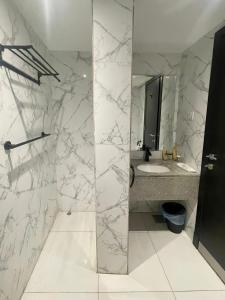 a bathroom with a sink and a mirror at Durat Al Urubah in Riyadh +42 photos