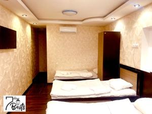 Postel nebo postele na pokoji v ubytování 7 Baits Hotel