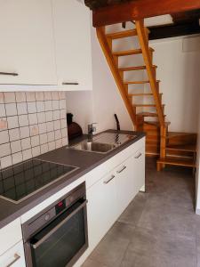 Kuchyň nebo kuchyňský kout v ubytování Casa Antica Corte