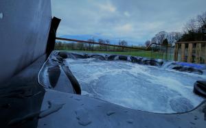 a jacuzzi tub with water in it at Riverview Retreat in Perth