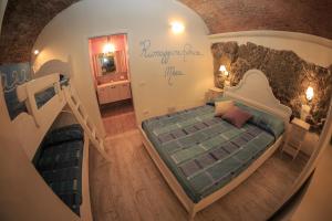 En eller flere senge i et værelse på Rifugio dei Pescatori
