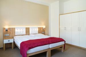 מיטה או מיטות בחדר ב-Hotel Astoria