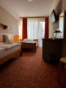 Posteľ alebo postele v izbe v ubytovaní Nereus Park Hotel