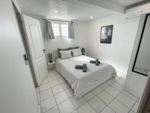 Rúm í herbergi á Chez Rey