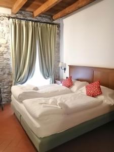 Postel nebo postele na pokoji v ubytování Cascina Belvedì