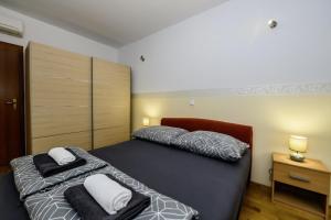 Un pat sau paturi într-o cameră la Bonaca in Kaštela - Dalmatien