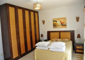 Ένα ή περισσότερα κρεβάτια σε δωμάτιο στο Villa Master Premium 5 Quartos Vista Mar - Area Gourmet