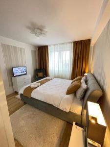 Un pat sau paturi într-o cameră la Apartament confortabil Alba Iulia