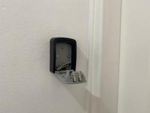 a black electrical outlet on a white wall at Riana Latchi Apartment in Polis Chrysochous