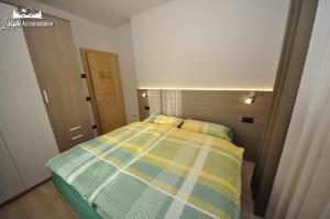Posteľ alebo postele v izbe v ubytovaní Al Bait da Valeriano by Livigno Accomodation