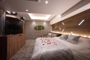 Postel nebo postele na pokoji v ubytování hotel brattostay ホテル ブラットステイ