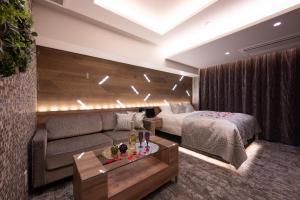 Postel nebo postele na pokoji v ubytování hotel brattostay ホテル ブラットステイ