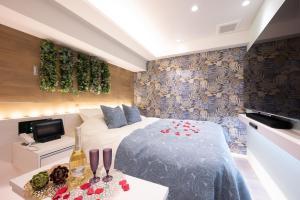 Postel nebo postele na pokoji v ubytování hotel brattostay ホテル ブラットステイ