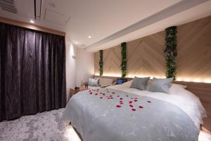 Postel nebo postele na pokoji v ubytování hotel brattostay ホテル ブラットステイ