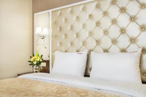 Postel nebo postele na pokoji v ubytování BonApart Hotel by UHM