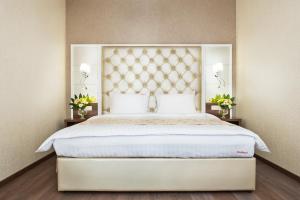Postel nebo postele na pokoji v ubytování BonApart Hotel by UHM