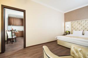 Postel nebo postele na pokoji v ubytování BonApart Hotel by UHM