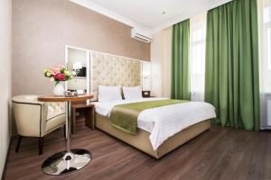 Postel nebo postele na pokoji v ubytování BonApart Hotel by UHM