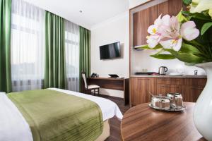 Postel nebo postele na pokoji v ubytování BonApart Hotel by UHM