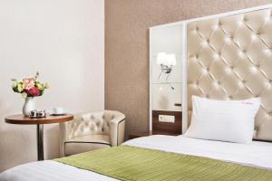 Postel nebo postele na pokoji v ubytování BonApart Hotel by UHM